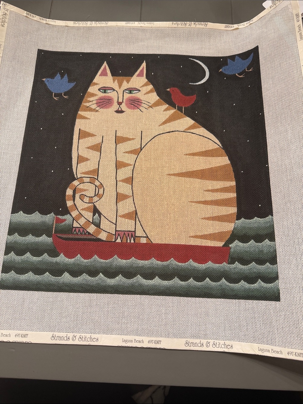 needlepoint canvas featuring a cat on a boat folk art  , 🐈‍⬛